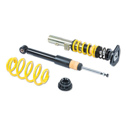 One vehicle suspension coilover, one unsleeved black coilover strut and one yellow coilover spring