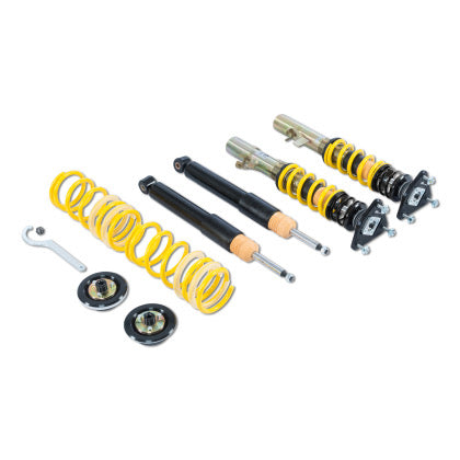 Two vehicle suspension adjustable coilovers, two unsleeved coilover struts and two coilover springs with end fittings and tool