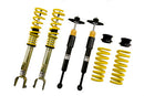 Two assembled adjustable suspension coilovers , two unsleeved coilover struts and two yellow lowering springs