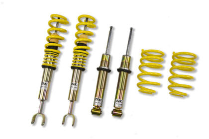 Two vehicle suspension coilovers, two coilovers without springs and two yellow springs shown separately