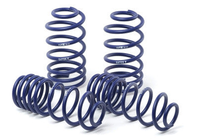 4 blue vehicle suspension lowering springs.