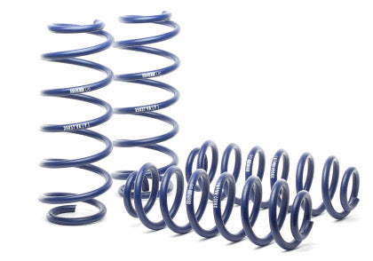 4 blue vehicle suspension lowering springs.