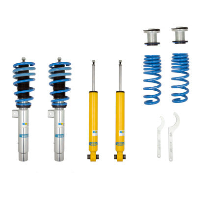 2 Bilstein zinc plated vehicle suspension coilovers with blue fitted springs, 2 yellow bodied Bilstein coilovers and 2 blue springs with 2 spring perches and 2 coilover adjustment tools.