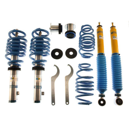 2 Bilstein zinc plated vehicle suspension coilovers with fitted blue springs, 2 Bilstein yellow bodied coilovers with fitted blue strut sleeve, 2 blue springs, 2 coilover adjustment tools and coilover fittings.