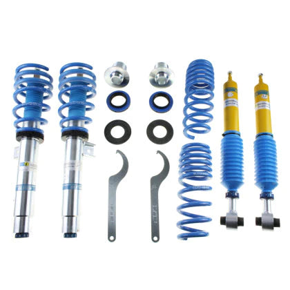 2 Bilstein zinc plated vehicle suspension coilovers with fitted blue springs, 2 Bilstein yellow bodied coilovers with fitted blue strut sleeve, 2 blue springs, 2 coilover adjustment tools and coilover fittings.