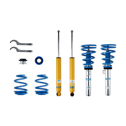 2 Bilstein chrome bodied vehicle suspension coilovers with fitted blue sleeve and blue springs, 2 yellow bodied coilovers, 2 blue springs, fittings and 2 coilover adjustment tools.