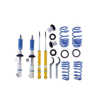 2 Bilstein chrome bodied vehicle suspension coilover struts with fitted blue sleeves, 2 yellow bodied coilover struts, 4 blue coilover springs with 2 perch spring fittings , o-rings and 2 coilover adjustment tools.