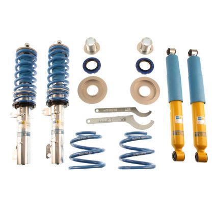 2 Bilstein chrome body vehicle suspension coilovers with blue springs, and blue strut sleeve, 2 Bilstein yellow bodied coilover struts with blue sleeves, 2 blue springs, fittings and 2 coilover adjustment tools.