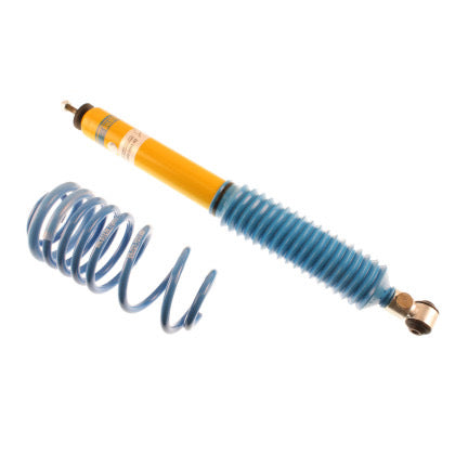 1 yellow body vehicle suspension coilover with blue strut sleeve and 1 blue spring.