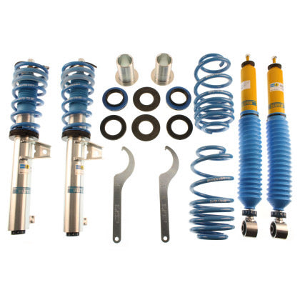 2 Bilstein vehicle suspension zinc plated vehicle suspension coilovers with fitted blue sleeve and fitted blue spring, 2 yellow bodied vehicle suspension coilovers with fitted blue strut sleeve, 2 blue springs and 2 coilover adjustment tools with coilover fittings.