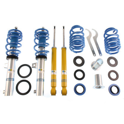 2 assembled vehicle zinc coated suspension coilovers with blue strut sleeves and springs, 2 yellow body coilovers, 2 blue springs, 2 coilover adjustment tools and fittings.