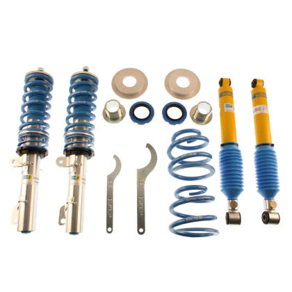 2 Bilstein zinc plated coilovers with fittd blue strut sleeve and fitted blue spring, 2 Bilstein yellow bodied coilovers with fitted blue strut sleeve, 2 blue coilover springs, 2 adjustment tools and fittings.