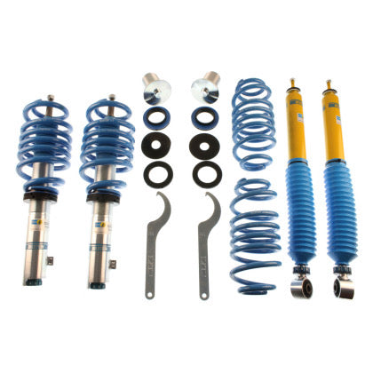 2 Bilstein vehicle suspension zinc plated coilover overs with fitted blue spring, 2 yellow bodied coilovers with fitted blue strut sleeve, 2 blue coilover springs and 2 coilover adjustment tools along with several fittings.