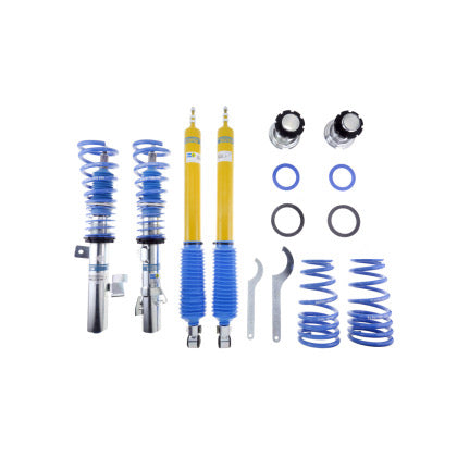 2 assembled vehicle coilovers with blue springsm 2 blue and yellow coilovers, 2 blue springs, adjustment tools and a number of fittings.