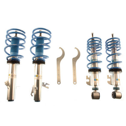 4 zinc plated vehicle suspension coilovers with blue strut sleeves and blue springs, 2 coilover adjustment tools.