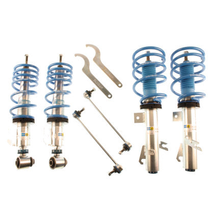 4 zinc plated vehicle suspension coilovers with blue springs, 2 coilover adjustment tools and 2 end links.