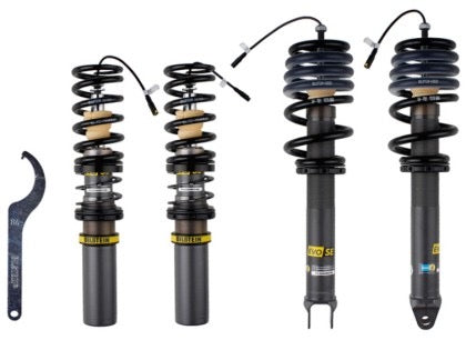 4 gray bodied vehicle suspension coilovers with fitted black springs and yellow accents.