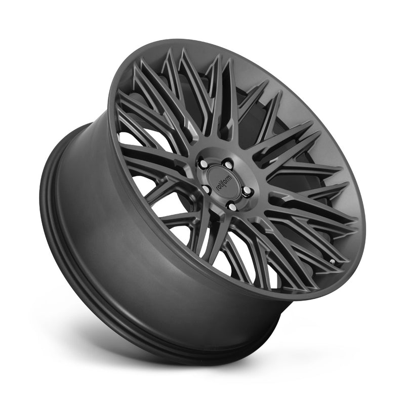 Tilted side view of a Rotiform JDR a monobock cast aluminum multi spoke automotive wheel in a matte anthracite finish with center cap with a black Rotiform logo.