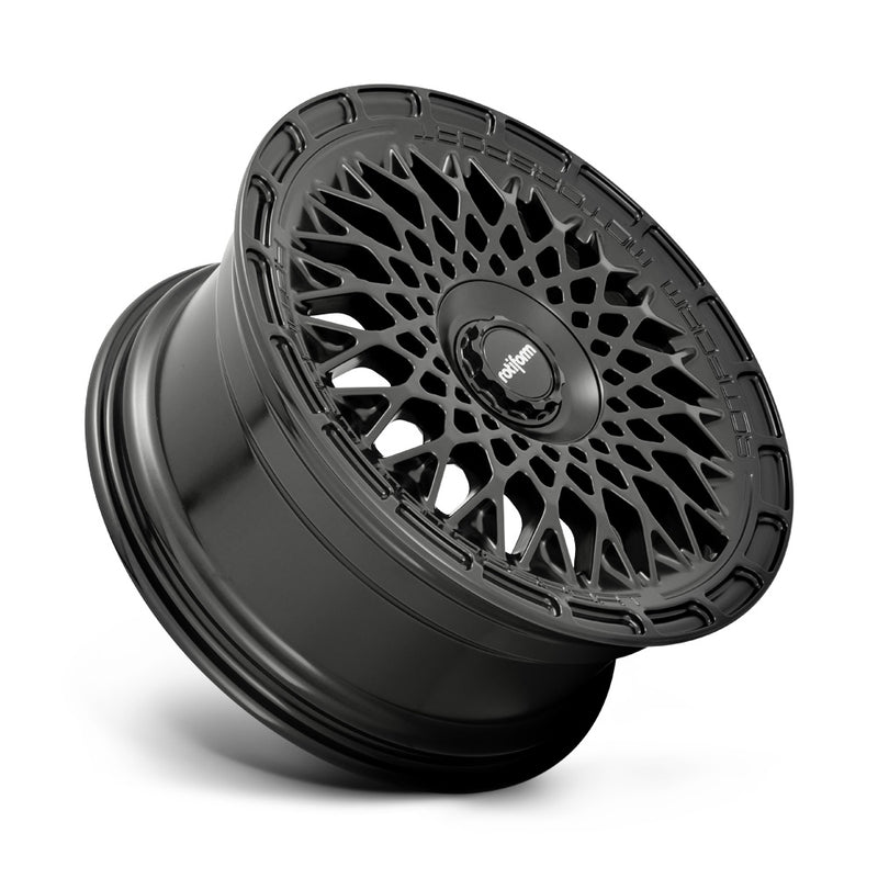 Tilted side view of a Rotiform LHR-M monoblock cast aluminum automotive wheel in a matte black finish with the wording Rotiform Motorsport embossed on outer edge and a black center cap with Rotiform silver logo.