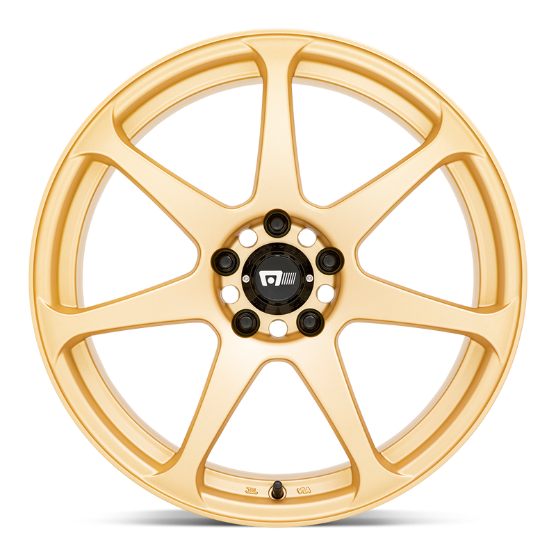 Front face view of a Motegi Racing Battle cast aluminum 7 spoke automotive wheel in a gold finish with a black center cap displaying a silver Motegi logo.