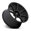 Tilted side view of a Motegi Racing Battle cast aluminum 7 spoke automotive wheel in a matte black finish with a black center cap displaying a silver Motegi logo.