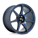 Motegi Racing Battle cast aluminum 7 spoke automotive wheel in a midnight blue finish with a black center cap displaying a silver Motegi logo.