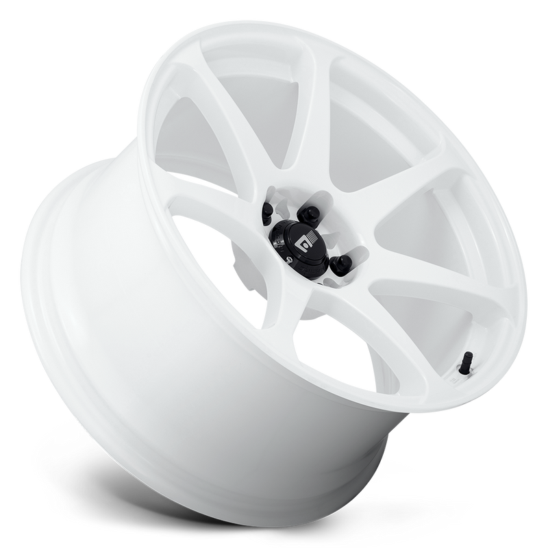 Tilted side view of a Motegi Racing Battle cast aluminum 7 spoke automotive wheel in white with a black center cap displaying a silver Motegi logo.