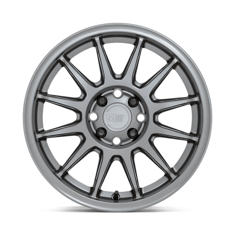 Front face view of a Motegi aRacing S12 cast aluminum 12 spoke automotive wheel in a gloss gunmetal finish with a Motegi logo center cap.