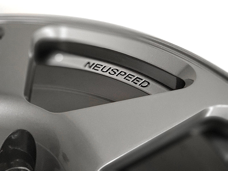 Close up of the name Neuspeed etched into the inner lip of an automotive alloy wheel.