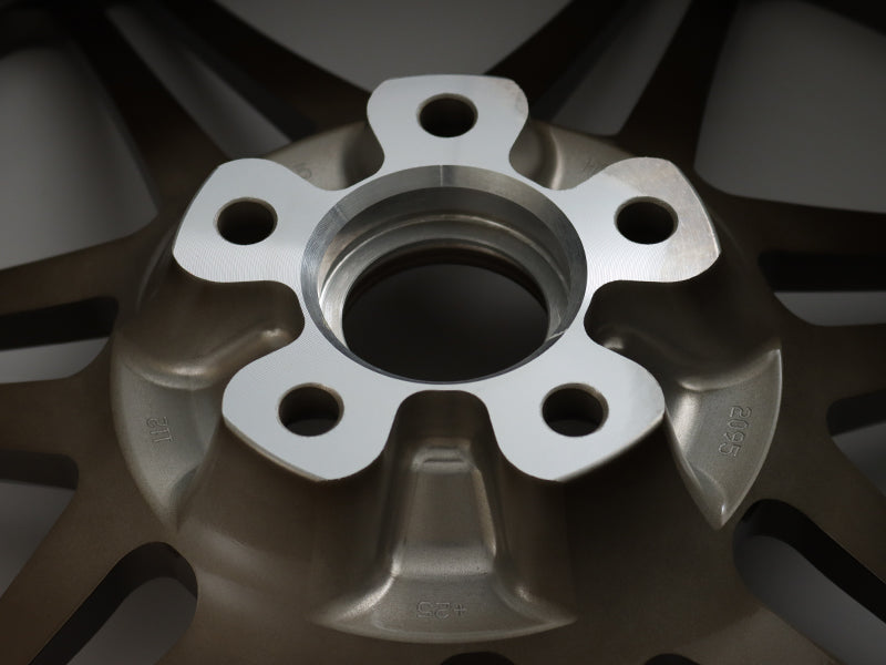Rear view of the center and lug holes of a Neuspeed automotive allow wheel.