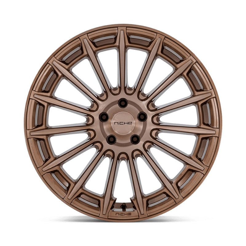 Front face view of a Niche Amalfi monoblock cast aluminum 15 spoke automotive wheel in a platinum bronze finish with an embossed Niche logo on the outer lip and a Niche logo center cap.