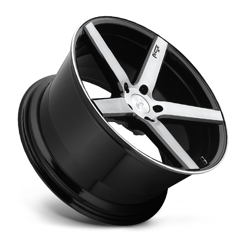 Tilted side view of a Niche Milan monoblock cast aluminum 5 smooth spoke automotive wheels in a brushed gloss black finish with an embossed Niche logo on one spoke and a Niche silver logo center cap.
