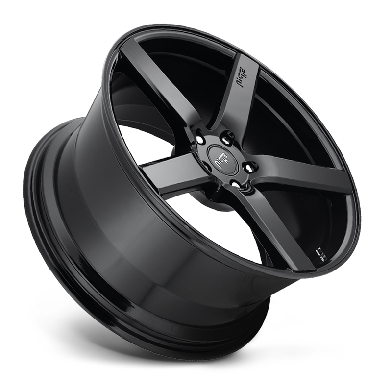 Tilted side view of a Niche Milan monoblock cast aluminum 5 smooth spoke automotive wheels in a gloss black finish with an embossed Niche logo on one spoke and a Niche silver logo center cap.