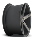 Side view of a Niche Milan monoblock cast aluminum 5 spoke automotive wheel in a matte black machined double dark tint finish with an embossed Niche logo in one spoke and a Niche silver logo center cap.