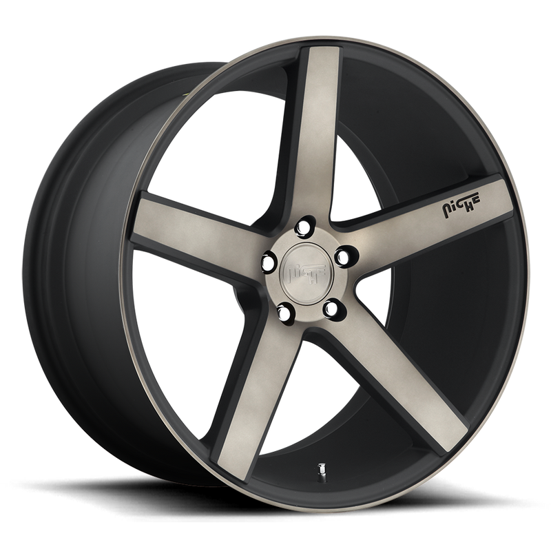 Niche Milan monoblock cast aluminum 5 smooth spoke automotive wheels in a matte black finish with a machined double dark tint and an embossed Niche logo on one spoke along with a Niche silver logo center cap.