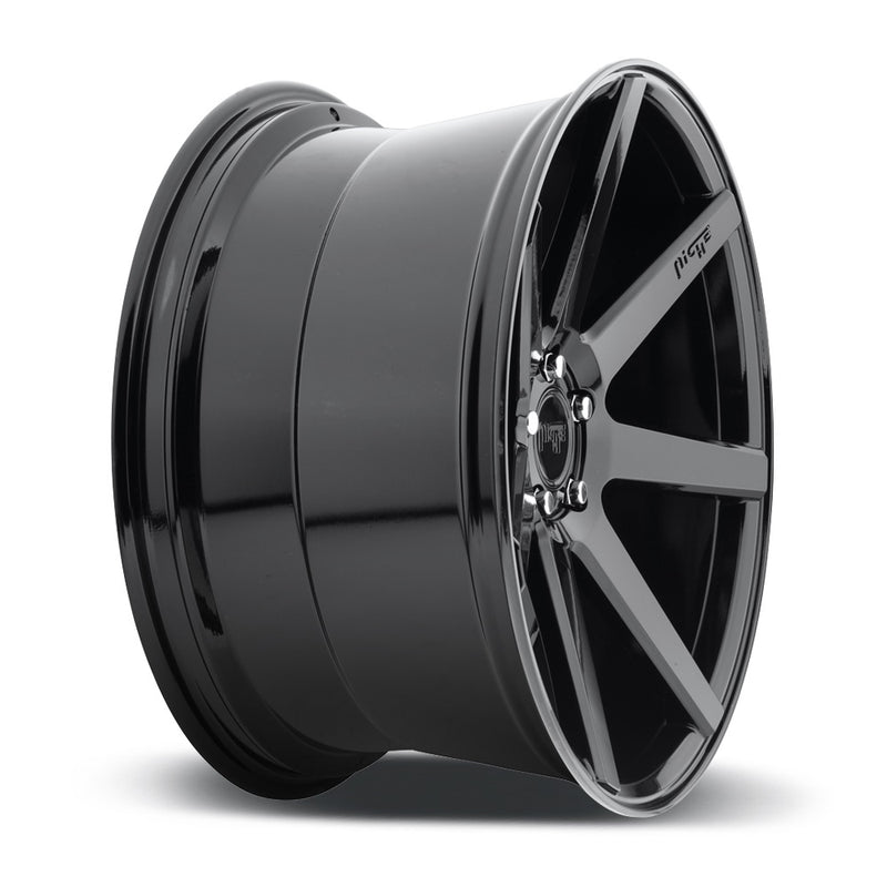 Side view of a Niche Verona monoblock cast aluminum 7 spoke concave profile automotive wheel in a gloss black finish with an embossed Niche Logo on one spoke and a Niche black logo center cap.