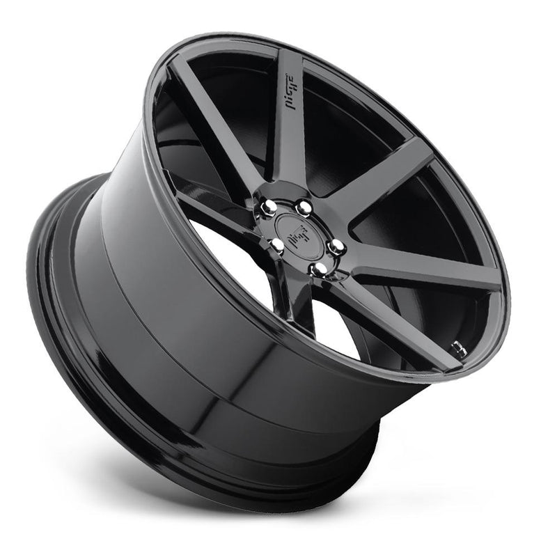 Tilted side view of a Niche Verona monoblock cast aluminum 7 smooth spoke automotive wheel in a gloss black finish with an embossed Niche logo on one spoke and a Niche black logo center cap.