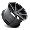 Tilted side view of a Niche Verona monoblock cast aluminum 7 spoke concave profile automotive wheel in a gloss black finish with an embossed Niche Logo on one spoke and a Niche black logo center cap.