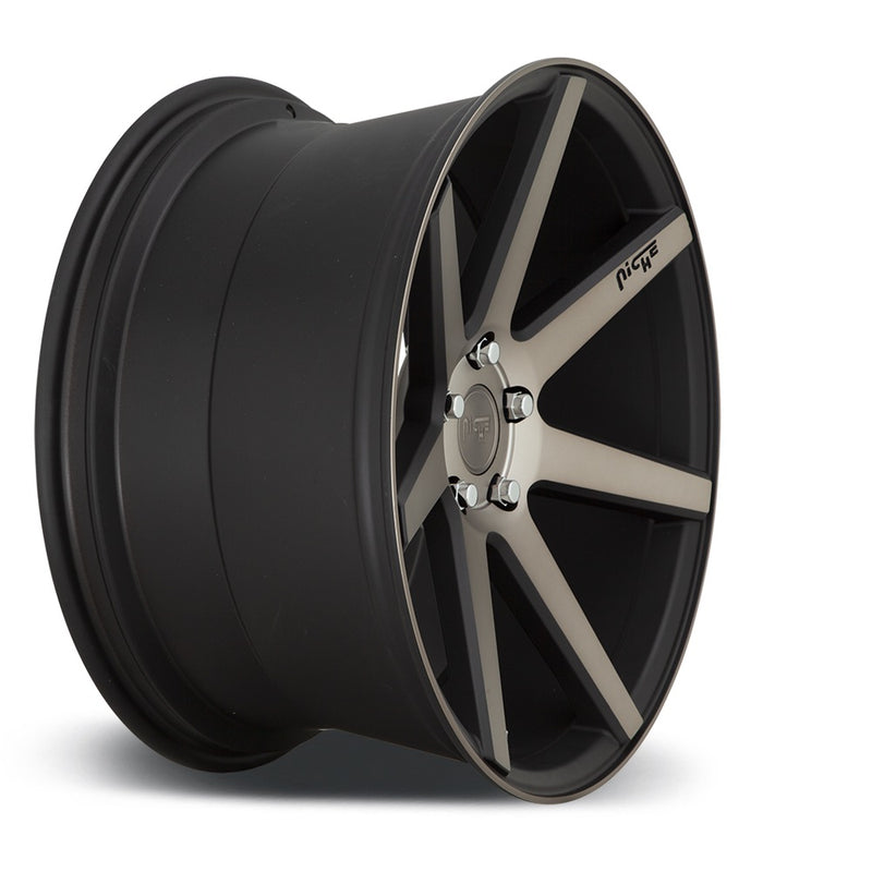 Side view of a Niche Verona monoblock cast aluminum 7 spoke concave profile automotive wheel in a matte black machined finish with an embossed Niche Logo on one spoke and a Niche logo center cap.