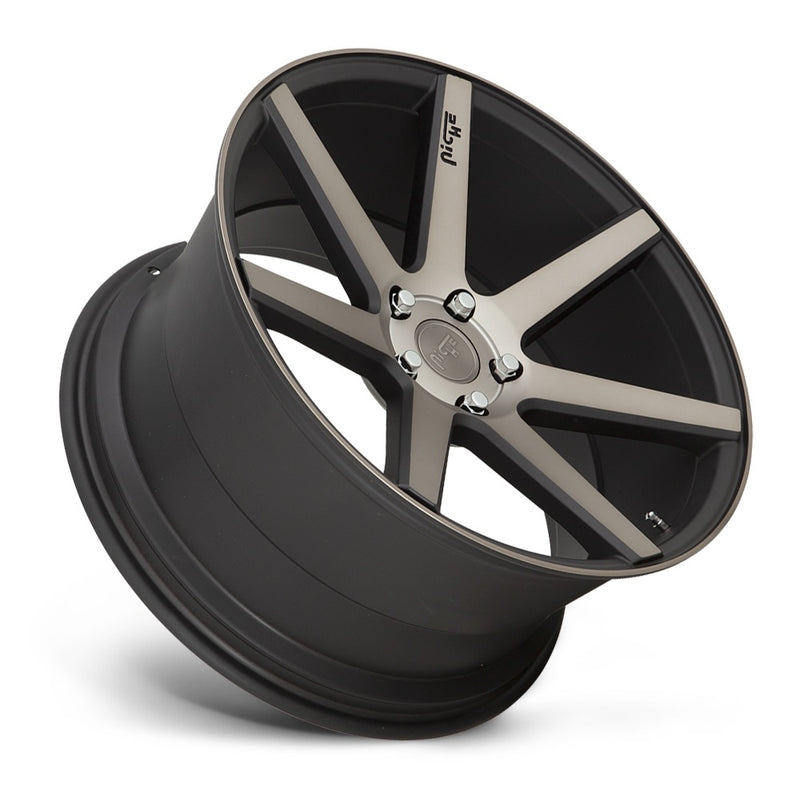 Tilted side view of a Niche Verona monoblock cast aluminum 7 spoke concave profile automotive wheel in a matte black machined finish with an embossed Niche Logo on one spoke and a Niche logo center cap.
