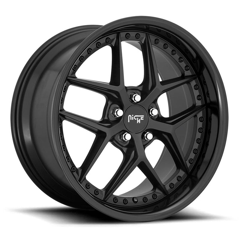 Niche Vice monoblock cast aluminum 5 Y spoke design automotive wheel in a gloss black matte black finish with a stud pattern around the bead ring and a Niche silver logo center cap.