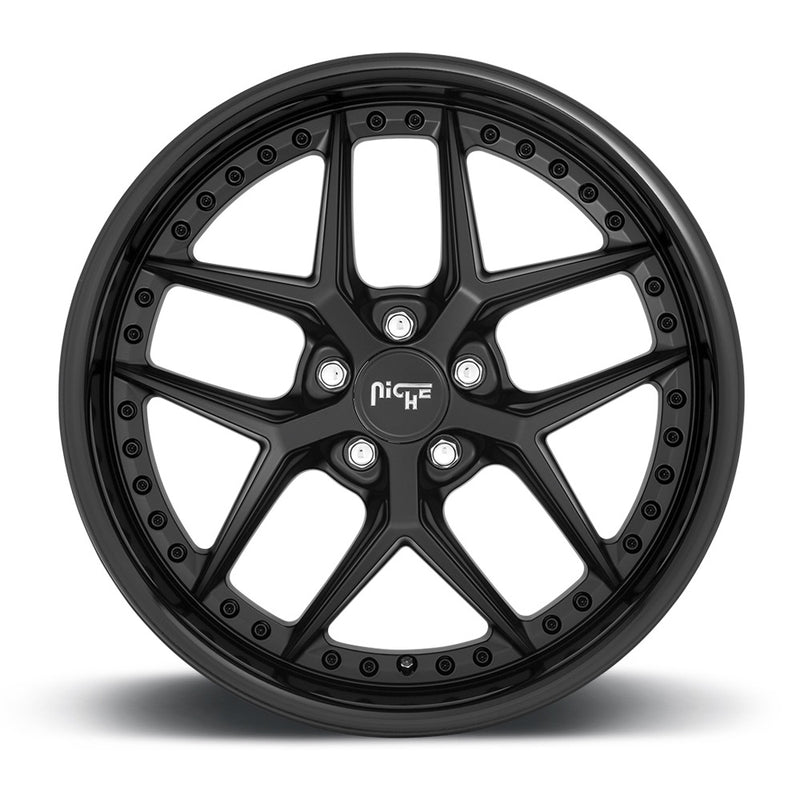 Front face view of a Niche Vice monoblock cast aluminum  5 V shape spoke automotive wheel in a gloss black matte black finish with a bolt design on the inner lip and a Niche logo center cap.