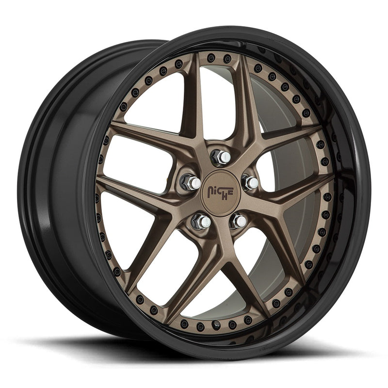 Niche Vice monoblock cast aluminum  5 V shape spoke automotive wheel in a matte bronze with black bead ring finish with a bolt design on the inner lip and a Niche logo center cap.