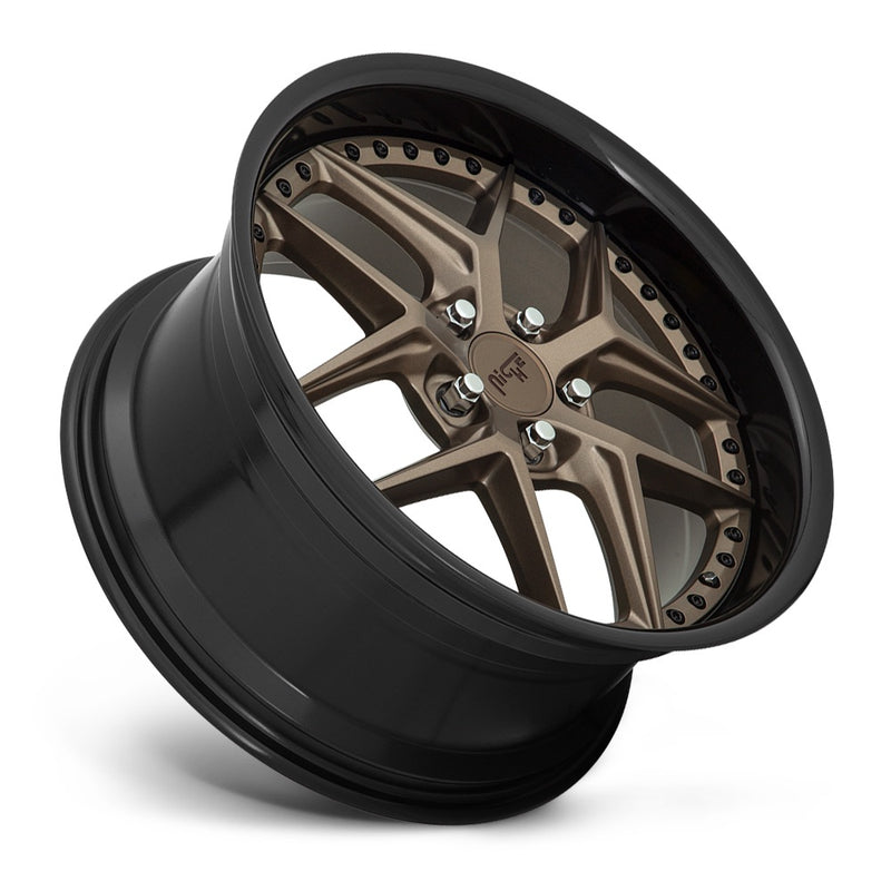 Tilted side view of a Niche Vice monoblock cast aluminum 5 V shape spoke automotive wheel in a matte bronze with black bead ring finish with a bolt design on the inner lip and a Niche logo center cap