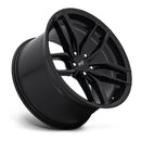 Tilted side view of a Niche Vosso monoblock cast aluminum 5 double spoke automotive wheel in a matte black finish with an embossed Niche logo on the outer lip and a Niche logo center cap.