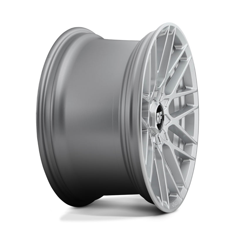 Side view of a Rotiform RSE monoblock cast aluminum 9 V-shaped spoke automotive wheel in gloss silver with a Rotiform RF logo center cap and Rotiform logo embossed on outer lip.