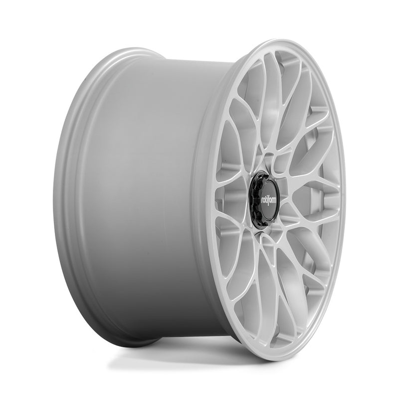 Side view of a Rotiform SGN monoblock cast aluminum 10 spoke automotive wheel in a gloss silver finish with a black center cap with a silver Rotiform logo.