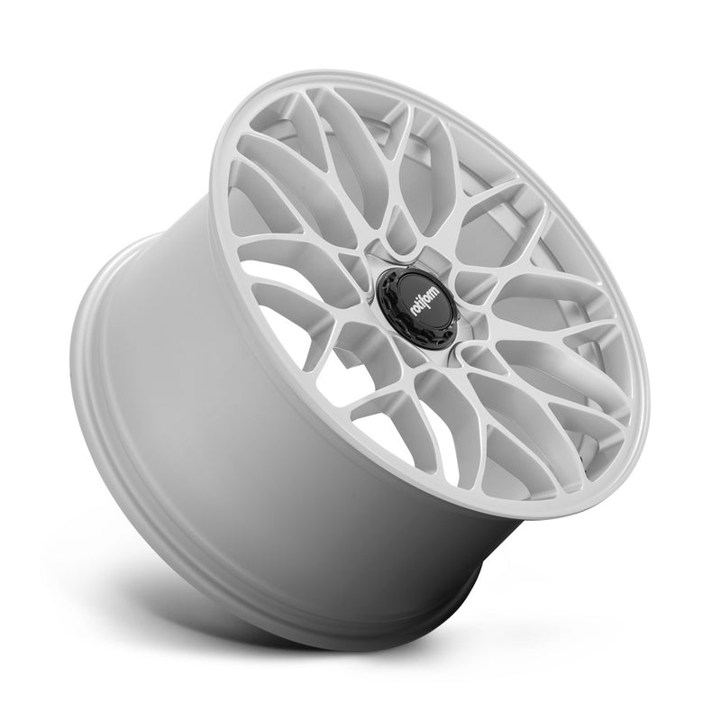 Tilted side view of a Rotiform SGN monoblock cast aluminum 10 spoke automotive wheel in a gloss silver finish with a black center cap with a silver Rotiform logo.