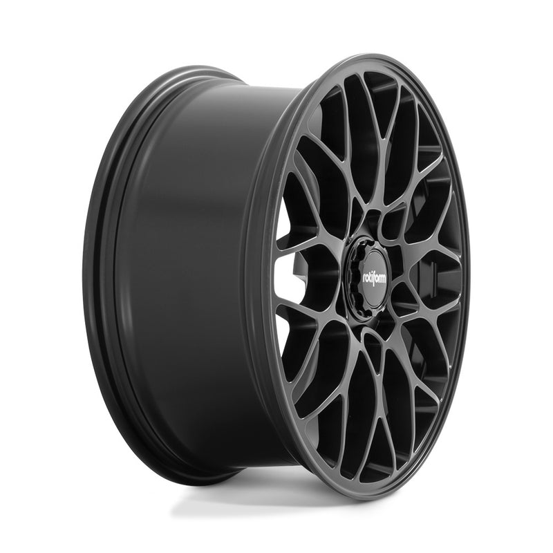 Side view of a Rotiform SGN monoblock cast aluminum 10 spoke automotive wheel in a matte black finish with a black center cap with a silver Rotiform logo.