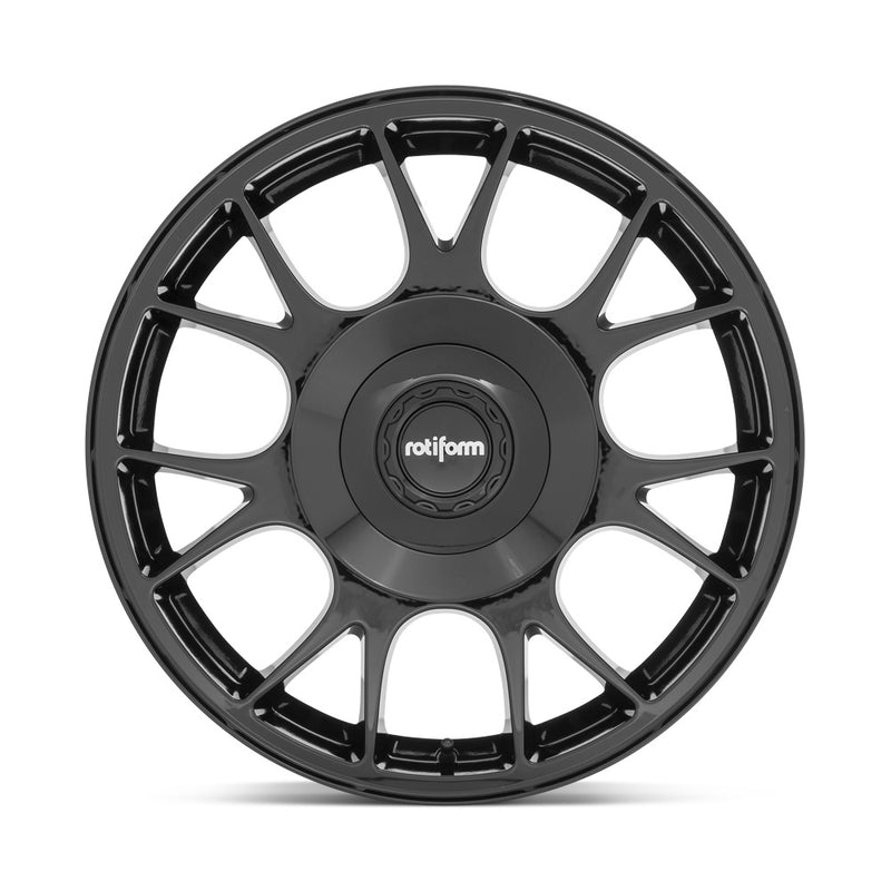 Front face view of a Rotiform TUF-R monoblock cast aluminum 7 spoke design automotive wheel in gloss black finish with a black center cap with a silver Rotiform logo.